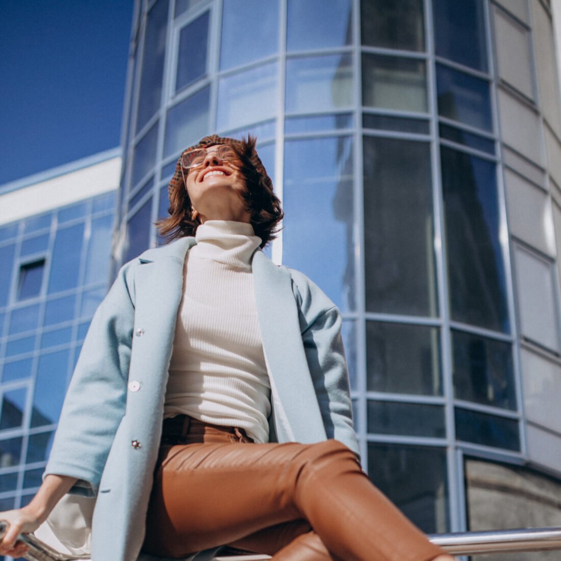 Young business woman in casual outfit by the business center